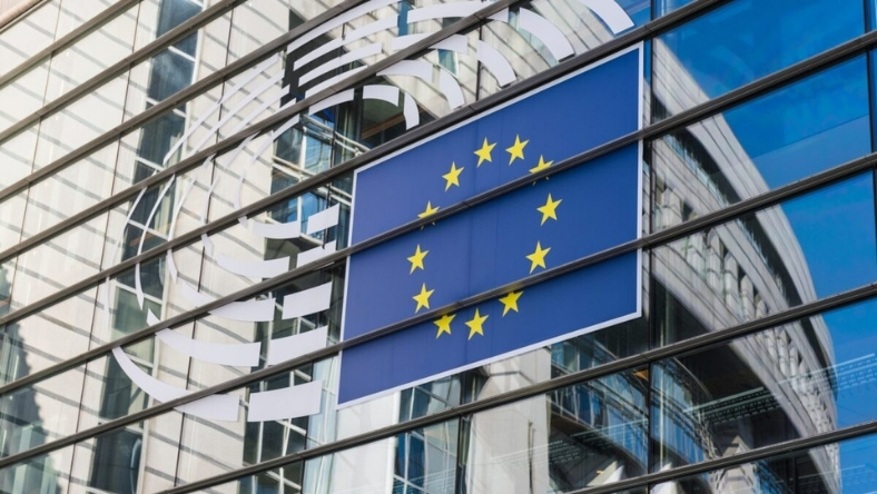 European Union flag on glass facade symbolizing EU backed initiatives