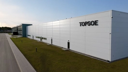 White Topsoe manufacturing facility exterior with clean architectural lines and dark signage lettering
